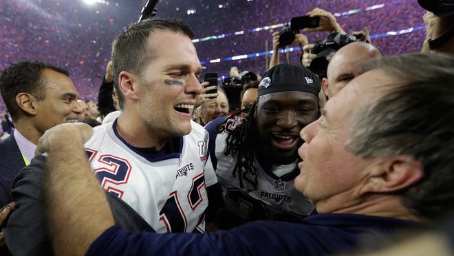 New England Patriots’ Tom Brady celebrates with head coach Bill Belichick after winning the NFL Super Bowl 51 football game against the Atlanta Falcons in overtime Sunday, Feb. 5, 2017, in Houston. The Patriots won 34-28. (AP Photo/David J. Phillip)