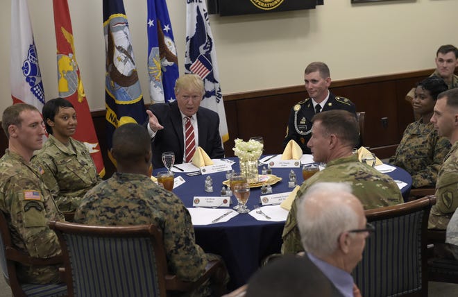President Donald Trump has lunch with troops while visiting U.S. Central Command and U.S. Special Operations Command at MacDill Air Force Base, Fla., Monday, Feb. 6, 2017. Trump, who spent the weekend at Mar-a-Lago, stopped for a visit to the headquarters before returning to Washington. (AP Photo/Susan Walsh)