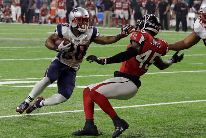 New England Patriots' James White runs for a touchdown as Atlanta Falcons' Deion Jones attempts to defend during overtime of the NFL Super Bowl 51 football game against the Atlanta Falcons, Sunday, Feb. 5, 2017, in Houston. The Patriots defeated the Falcons 34-28. (AP Photo/Patrick Semansky)