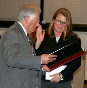 Michele Beckman is sworn in Monday night by Corning Mayor Richard Negri after the City Council appointed her the Ward 2 representative. [SHAWN VARGO/THE LEADER]