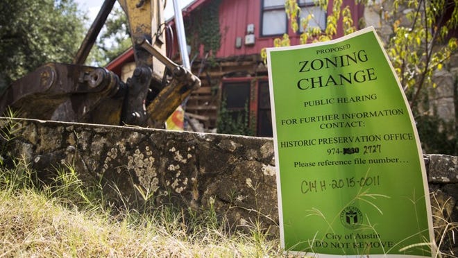 A historic zoning sign sits in front of a South Austin home slated for demolition in August 2015.