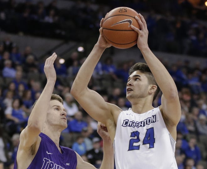 Creighton's Kobe Paras (24) goes for a layup against Truman State's Jacob Socha (2) during a game on Jan. 14 in Omaha, Neb. The 19-year-old Paras boasts a social media following that includes 461,000 on Instagram and 114,000 on Twitter. A YouTube video of him winning a dunking contest drew more than 1.7 million views. [AP Photo/Nati Harnik, File]