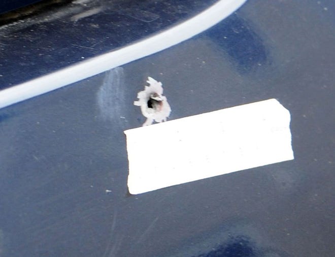 An October 2016 file photo shows a bullet-ridden car on Tribou Street in Brockton.