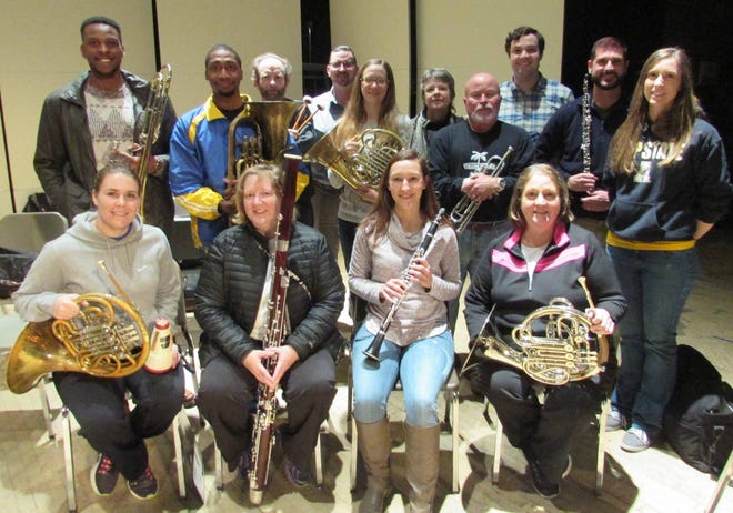 Pictured are Gaston County members of the Carolinas Wind Orchestra. From left, front row: Ashleigh Cook, band director at Cherryville High; Lisa Ratchford, band director at Cramerton Middle; Emily Webb, band director at Holbrook Middle; and Jeanette Myres, teacher at St. Michael Catholic School; back row: Joel Jeffries, band director at Hunter Huss High; Oshae Best, band director at Bessemer City Middle; Rick Fischer, band director at Gaston Day; Jason Gilchrist, rep for Music Center; Ruth Powell, Gaston Symphonic Band alumni; Sarah Cole, band director at Piedmont Charter; Chris Cole, band director Piedmont Charter; Andrew Blair, Gastonia native; Rick Myres, band director at Mount Holly Middle; and Christyl Barber, Gaston County native/percussion instructor. [photo courtesy of Rick Fischer/Gaston Day School]