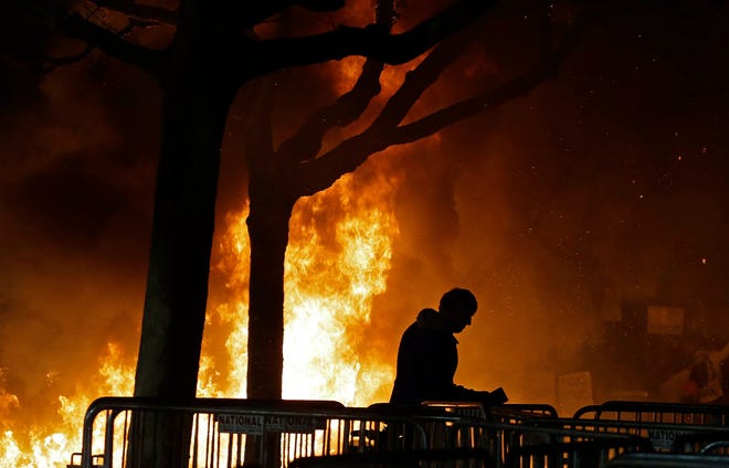 A bonfire set by demonstrators protesting a scheduled speaking appearance by Breitbart News editor Milo Yiannopoulos burns on Sproul Plaza on the University of California at Berkeley campus on Wednesday, Feb. 1, 2017, in Berkeley, California.