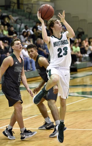Lakewood Ranch High's Brock Sisson (23) scores a basket against Venice High during the Class 8A-District 11 semifinal game Wednesday, Feb., 8, 2017, at Lakewood Ranch High School. The Mustangs defeated the Indians, 71-46. [HERALD-TRIBUNE STAFF PHOTO / THOMAS BENDER]