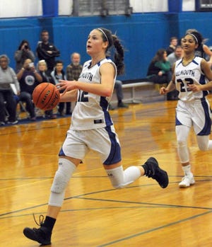 Eliza Van Voorhis of Falmouth Academy breaks away to score her 1000th point in a victory over Sturgis East on Jan. 12. Later, she celebrated with teammates including Kendall Currence (at right in photo). [Ron Schloerb/Cape Cod Times]