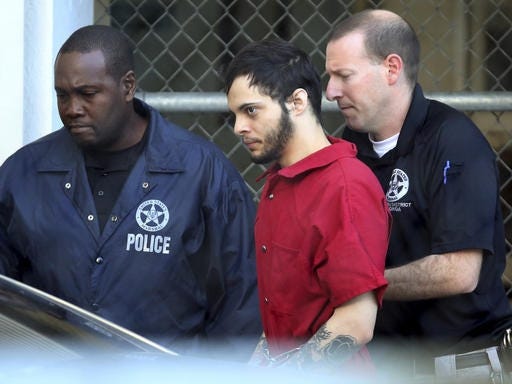 Esteban Santiago, center, leaves the Broward County jail for a hearing in federal court, Tuesday, Jan. 17, 2017, in Fort Lauderdale, Fla. Santiago is accused of a Jan. 6 shooting rampage at a Fort Lauderdale-Hollywood International Airport baggage claim area that left several people dead and others wounded. (Amy Beth Bennett/South Florida Sun-Sentinel via AP)