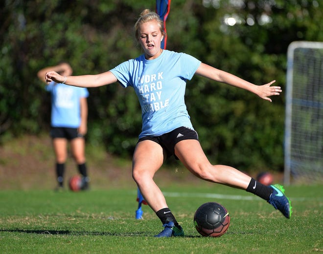 Payton Crews takes a shot to the goal during a practice drill. St. Johns Country Day School, ranked first in the nation, enters the state semifinals Friday. (Bruce Lipsky/Florida Times-Union)
