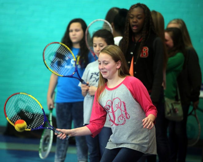 Emeri Leonhardt, 11, does tennis drills while attending Girls and Women in Sports Day at Shelby City Park. [Brittany Randolph/The Star]