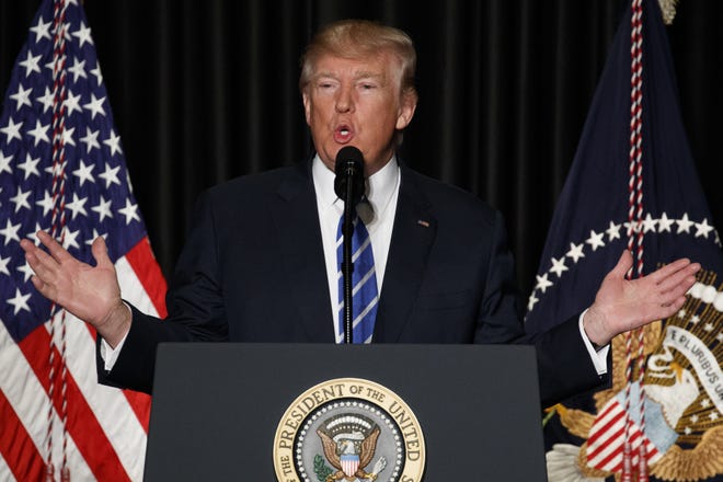 President Donald Trump speaks Wednesday to the Major County Sheriffs' Association and Major Cities Chiefs Association in Washington.Trump says it doesn't take a lawyer to see that his order banning visitors from seven Muslim-majority nations is a "common sense" move to protect the U.S. from terrorists.