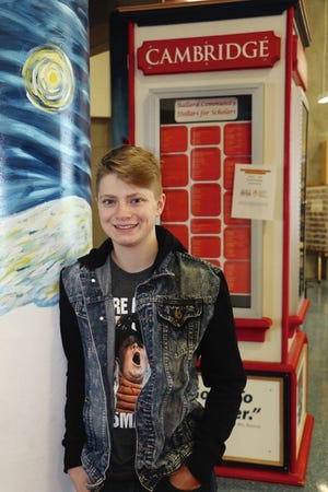 Alex Glenn is pictured in the commons area of Ballard High School, a school where he has helped to set up an organization — SAGA — for LGBTQ students to gain support. Photo by Marlys Barker