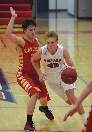 Ballard’s Tyler Ihle drives past Carlisle’s Jacob Howat during the second half of the Bombers’ 68-65 victory over the Wildcats Jan. 31 in Huxley. Ihle had 22 points, six rebounds and three steals in the win.