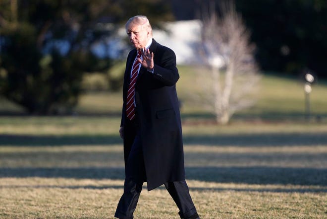 President Donald Trump waves as he walks across the South Lawn of the White House in Washington, Monday, Feb. 6, 2017, after returning from a weekend trip to Florida. (AP Photo/Pablo Martinez Monsivais)