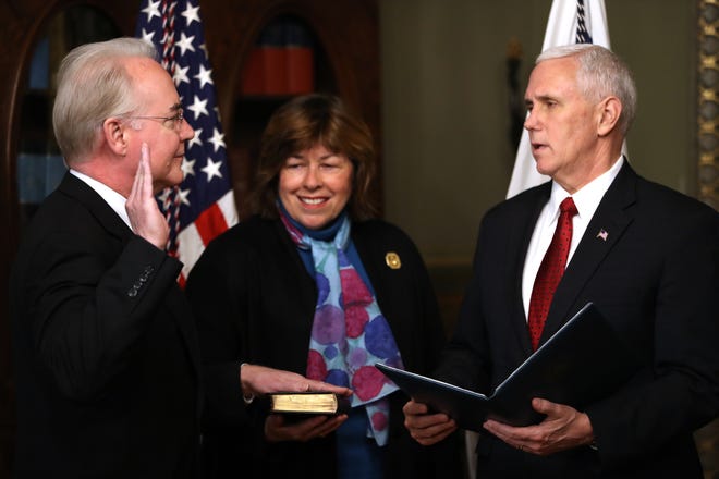 Vice President Mike Pence administers the oath of office to Health and Human Services Secretary Tom Price, accompanied by his wife Betty, Friday, Feb. 10, 2017, in the in the Eisenhower Executive Office Building on the White House complex in Washington. (AP Photo/Andrew Harnik)