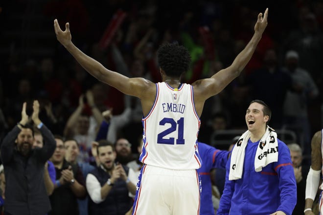 Sixers rookie center Joel Embiid encourages the fans during a Jan. 18 win over the Atlantic Division-leading Raptors.