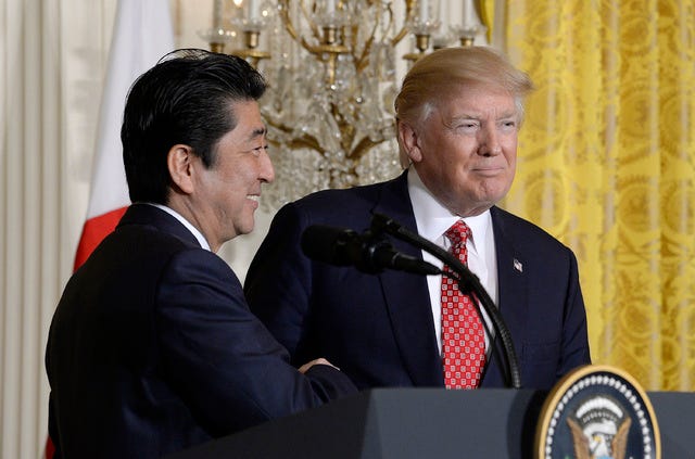 US President Donald Trump shakes hands with Japanese Prime Minister Shinzo Abe during a press conference in the East Room of the White House on Feb. 10, 2017, in Washington, D.C. (Olivier Douliery / Abaca Press / TNS)