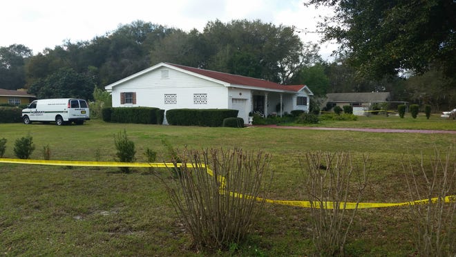 Rubye Harrison James's homes is cordoned off by crime scene tape Thursday. Authorities say it was clear to deputies who went to check on her Wednesday that something "suspicious" had happened in the house. [MILLARD IVES / DAILY COMMERCIAL]