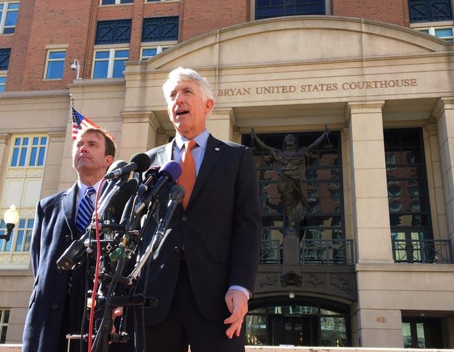 Virginia Attorney General Mark Herring, right, accompanied by Virginia Solicitor General Stuart Raphael, speaks outside the federal courthouse in Alexandria, Va., Friday, Feb. 10, 2017, following a hearing on President Donald Trump's travel ban. Lawyers for the state of Virginia are challenging President Donald Trump's executive order on immigration, arguing in federal court that his seven-nation travel ban violates the Constitution and is the result of "animus toward Muslims." THE ASSOCIATED PRESS
