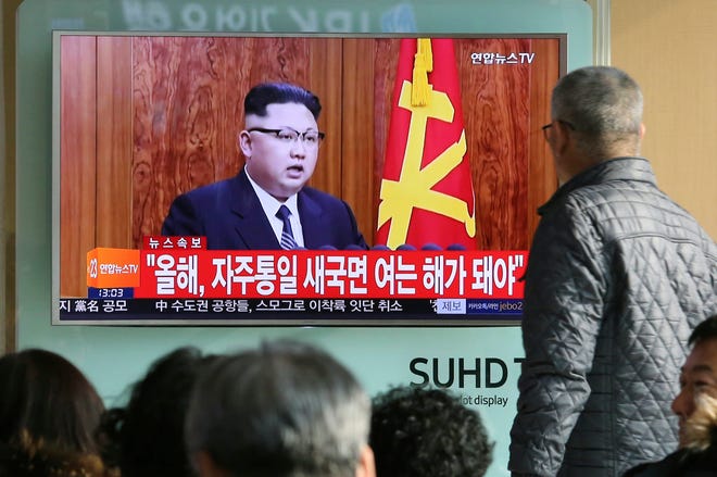 FILE - In this Sunday, Jan. 1, 2017 file photo, South Koreans watch a TV news program showing North Korean leader Kim Jong Un’s New Year’s speech, at the Seoul Railway Station in Seoul, South Korea. North Korea reportedly fired a ballistic missile early Sunday, Feb. 12, 2017, in what would be its first such test of the year and an implicit challenge to President Donald Trump’s new administration. Details of the launch, including the type of missile, were scant. The letters on the screen read “New Year for Reunification.” (AP Photo/Ahn Young-joon, File)