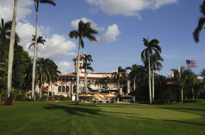 Mar-a-Lago is seen from the media van window in Palm Beach. Trump has described the sprawling Mar-a-Lago property as the Winter White House and has spent two weekends there this month. [CAROLYN KASTER / ASSOCIATED PRESS]
