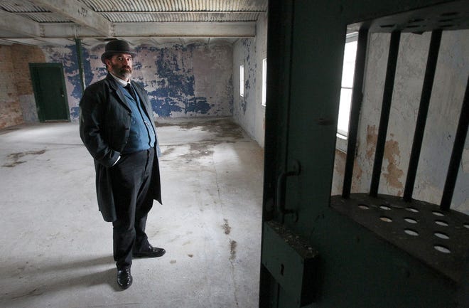 Gaston County Museum assistant director Jason Luker stands in the cell area of the old Dallas Jail where Caroline Shipp was held before she was hanged for the murder of her child on Jan. 22, 1892. Shipp is believed to be the last woman to be legally hanged in North Carolina and the last person in Gaston County. [JOHN CLARK/THE GAZETTE]