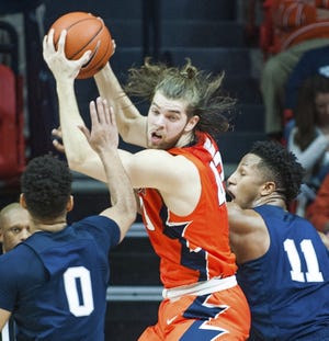 Illinois' forward Michael Finke (43) brings down an offensive rebound between Penn State's forward Lamar Stevens (11) and forward Payton Banks (0) during the second half of an NCAA college basketball game in Champaign, Ill., Saturday, Feb 11, 2017. Penn State won 83-70. (AP Photo/Robin Scholz)
