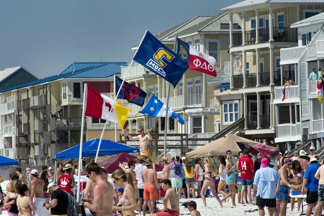 Spring breakers crowd the beach in Walton County in this file photo. FILE PHOTO/THE LOG