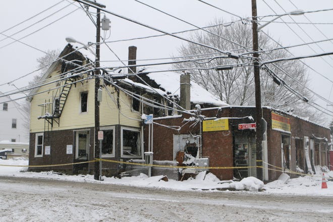 The burned out remains of the Albion village post office and adjoining apartment and convenience store on School and Main streets. [The Providence Journal / Kris Craig]