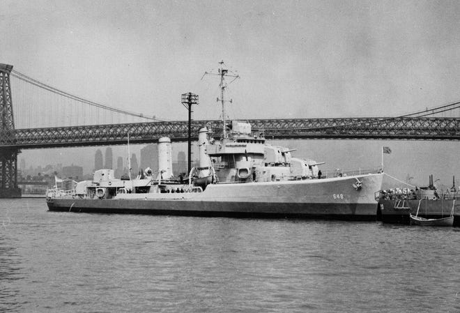 This undated file photo provided by the U.S. Navy shows the USS Turner on the East River in New York City near the Williamsburg Bridge. The USS Turner exploded and sank in 1944 and more than 130 of its sailors are still listed as missing. The Pentagon said that it will try to determine if dozens of sailors listed as missing were actually recovered and buried all along as unknowns in a New York cemetery. (U.S. Navy via AP, File)