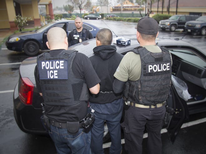 U.S. Immigration and Customs Enforcement arrest a man in Los Angeles. The arrest of an Apalachicola grocery store manager has sparked rumors of immigration raids targeting undocumented workers in the county, but immigration officials said there is no plan for ramped up enforcement. AP FILE
