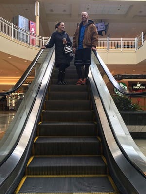 Courtney Taylor and her boyfriend, Zach Tobias, ride the escalator at a mall in Whitehall, Pa., on Feb. 9, 2017. Taylor and Tobias don't mix shopping with politics, but say it seems to be happening more often during the Donald Trump era as activists who either oppose or support the president target stores and brands for boycotts. (AP Photo/Michael Rubinkam)