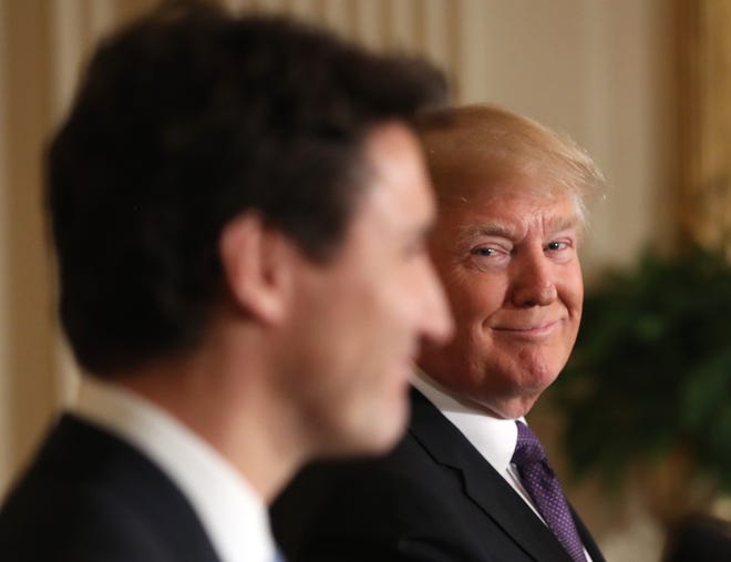 President Donald Trump smiles during a joint news conference with Canadian Prime Minister Justin Trudeau in the East Room of the White House in Washington, Monday, Feb. 13, 2017. (AP Photo/Andrew Harnik)