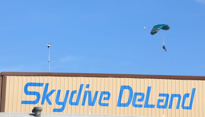 A sky diver remained hospitalized Monday after a hard landing at DeLand Municipal Airport last week. [News-Journal file/JIM TILLER]