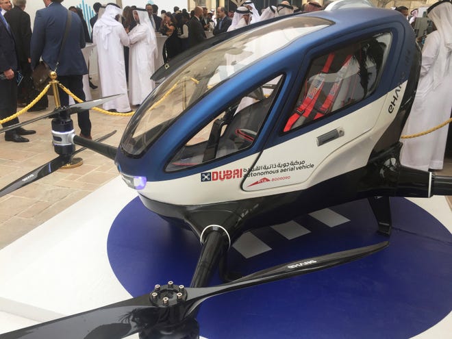 A model of EHang 184 and the next generation of Dubai Drone Taxi is seen during the second day of the World Government Summit in Dubai, United Arab Emirates, Monday, Feb. 13, 2017. Dubai hopes to have a passenger-carrying drone buzzing through the skyline of this futuristic city-state in July. Mattar al-Tayer, the head of Dubai's Roads & Transportation Agency, made the surprise announcement Monday at the World Government Summit. (AP Photo/Jon Gambrell)