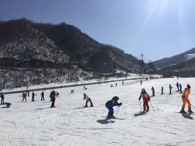 In this Saturday Feb. 11, 2017, photo, North Koreans ski at the Masik Pass Ski Resort in Wonsan, North Korea. North Korea's Olympic committee lashed out Monday, Feb. 13, 2017, against sanctions over its nuclear and long-range missile programs, claiming they are aimed at hurting the North's efforts to compete in international sports. Sanctions that block the sale of such items as skis, snowmobiles, snow groomers, yachts and even billiard tables are a "vicious ulterior political scheme," according to its National Olympic Committee. THE ASSOCIATED PRESS