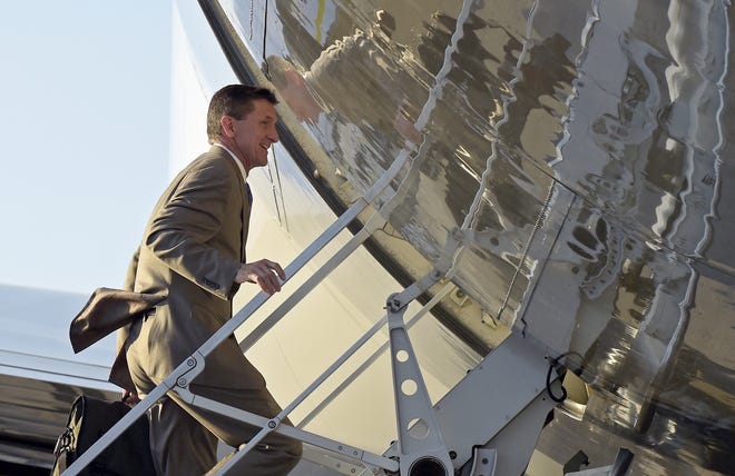 In this Feb. 12, 2017, photo, National Security Adviser Michael Flynn boards Air Force One at Palm Beach International Airport in West Palm Beach, Fla.. Flynn resigned as President Donald Trump's national security adviser Monday, Feb. 13, 2017. THE ASSOCIATED PRESS