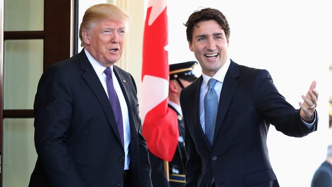 President Donald Trump greets Canadian Prime Minister Justin Trudeau upon his arrival at the White House in Washington, Monday, Feb. 13, 2017. (AP Photo/Andrew Harnik)