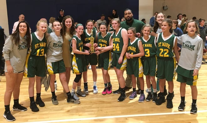 The St. Mark Catholic School Division I middle school girls basketball team won the Southeastern League Tournament on Feb. 6. The Lions avenged a pair of regular season losses to Myrtle Grove Christian School in the finals. [Contributed photo]