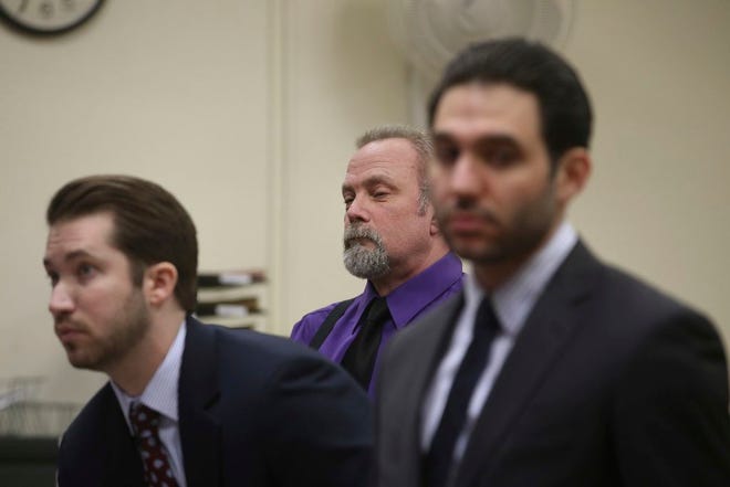 Dean Smith, center, a defendant in the Holland Tunnel weapons case, appears before Hudson County Superior Court Judge Mitzy Galis-Menendez in Jersey City, N.J., where he faces weapons possession charges. (Ed Murray/NJ Advance Media via AP, Pool)