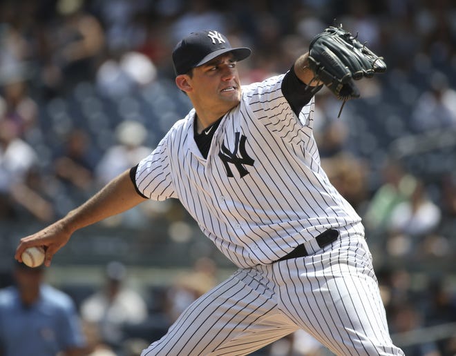 FILE - In this Sunday, July 24, 2016, file photo, New York Yankees starting pitcher Nathan Eovaldi throws during the first inning of the baseball game against the San Francisco Giants at Yankee Stadium in New York. The Tampa Bay Rays have finalized a $2 million, one-year contract with injured pitcher Nathan Eovaldi.

The 27-year-old right-hander is expected to miss the 2017 season while recovering from Tommy John surgery last August, when he was with the New York Yankees. (AP Photo/Seth Wenig, File)