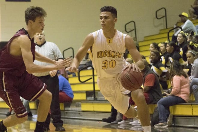 Lincolnton's Sage Surratt dribbles around a Bunker Hill defender during Tuesday's first-round game of the Southern District 7 Conference tournament at Lincolnton High School. [Tana Farmer/Lincoln Times-News]