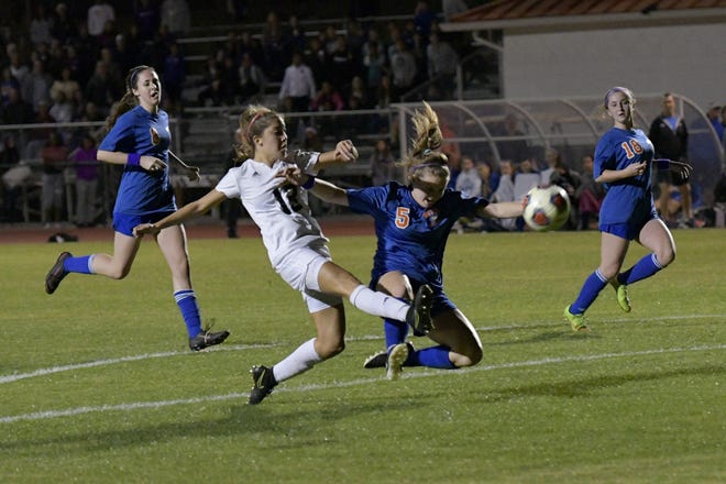 Montverde Academy's Maria Santin (13) takes a shot during a state semifinal game against Jacksonville Bolles in Montverde on Friday. [PAUL RYAN / CORRESPONDENT]