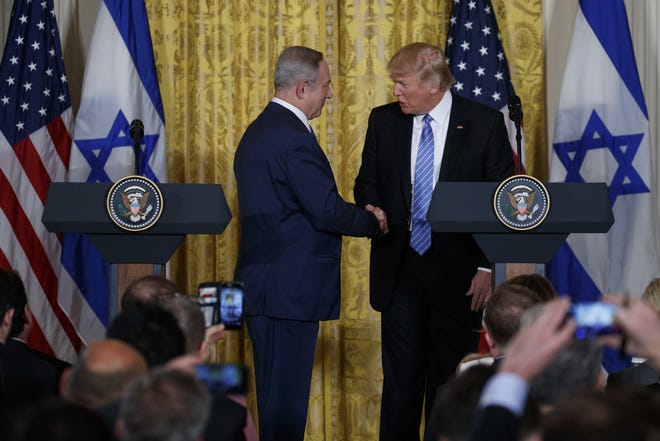 President Donald Trump and Israeli Prime Minister Benjamin Netanyahu shake hands during their joint news conference in the East Room of the White House, Wednesday, Feb. 15, 2017, in Washington. THE ASSOCIATED PRESS