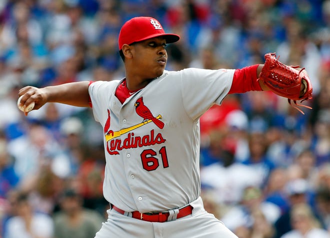 FILE - In this Sept. 24, 2016, file photo, St. Louis Cardinals starter Alex Reyes throws against the Chicago Cubs during the first inning of a baseball game in Chicago. Reyes needs season-ending Tommy John surgery on his right arm. General manager John Mozeliak confirmed the diagnosis after an MRI. Reyes didn't throw his scheduled bullpen session Tuesday, Feb. 14. 2017, because of a sore elbow. (AP Photo/Nam Y. Huh, File)