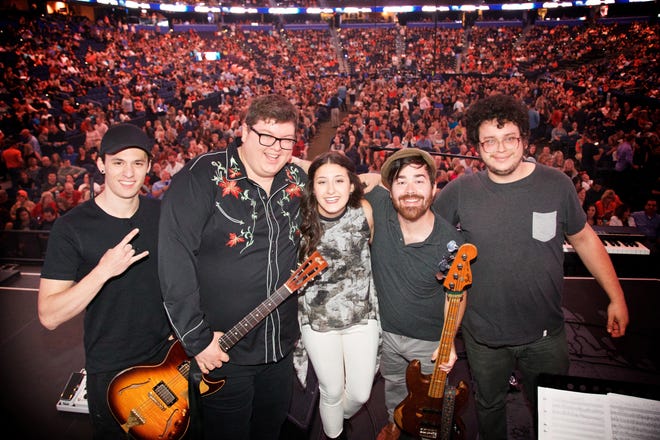 Hannah Jae Wasserman, center, is flanked by members of her backup band, from left: Matthew Vero, James Albritton, Andrew Glasgow and Damon Owens. Wasserman won a contest to perform at Amalie Arena. [PHOTO BY DAVID BERGMAN / TOURPHOTOGRAPHER.COM FOR BON JOVI]