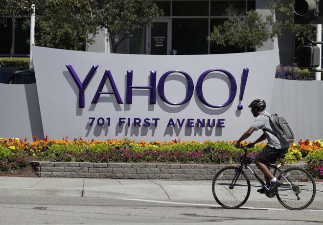 In this July 19, 2016 photo, a cyclist rides past a Yahoo sign at the company's headquarters in Sunnyvale, Calif. [AP file photo]