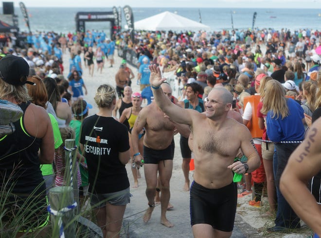 Athletes complete the swim portion of the Ironman Florida triathlon. Ironman is among the events boosting sports tourism in Panama City Beach. NEWS HERALD FILE PHOTO