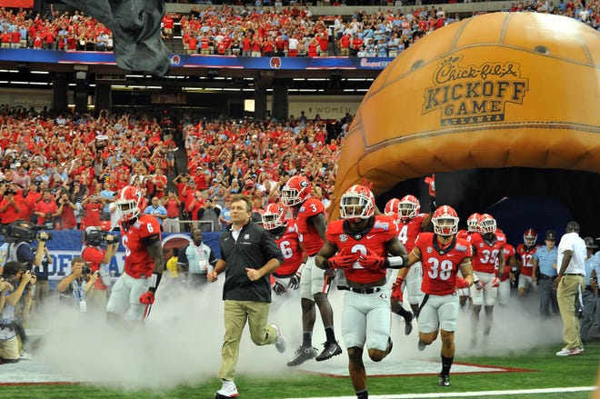 Georgia head coach Kirby Smart leads the players into the field before the Chick-fil-A Kickoff Game against North Carolina in the Georgia Dome in Atlanta, Ga., on Saturday, Sept. 3, 2016. (Photo by Perry McIntyre Jr.)