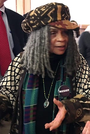 Sonia Sanchez speaks to people after African-American Read-In Day at Worcester State University Wednesday. [Paula Owen Photo]